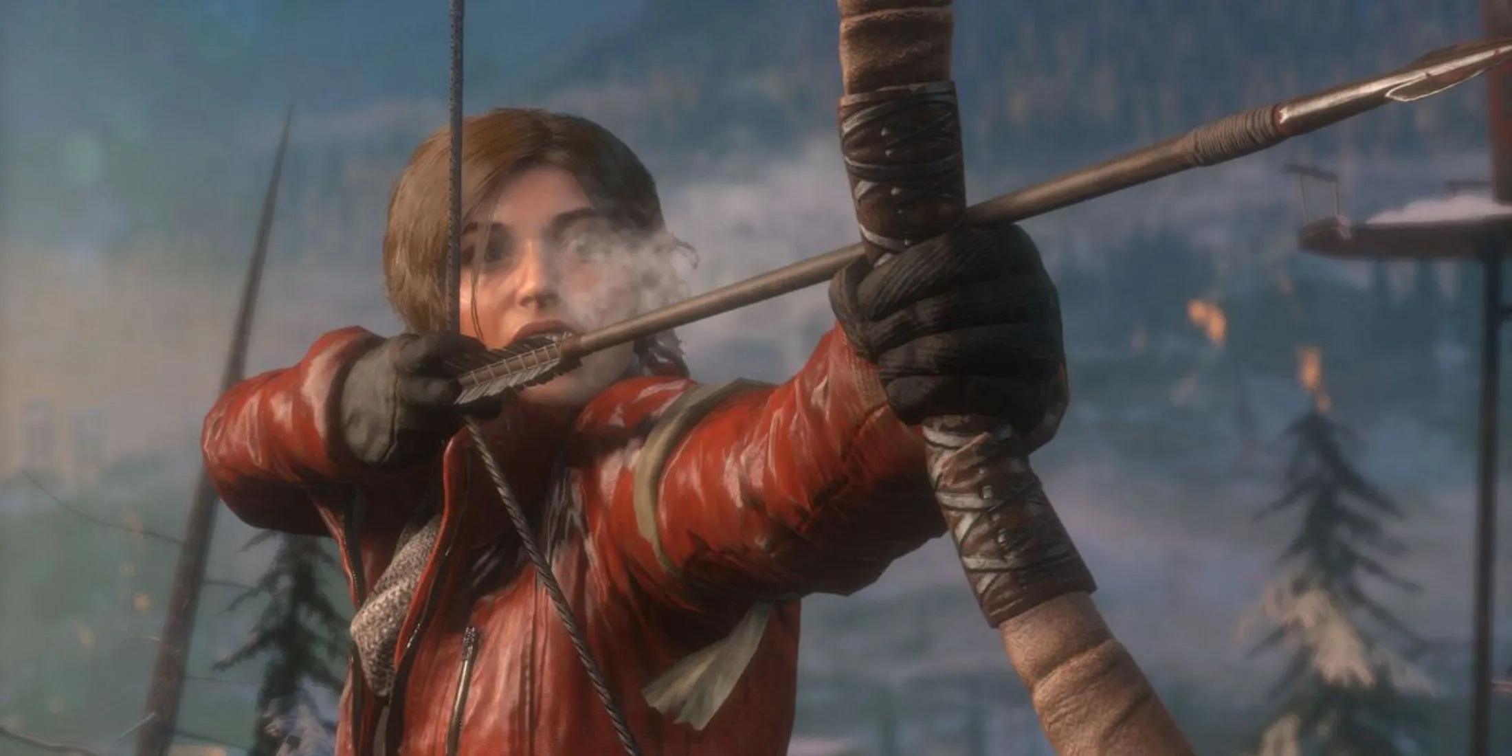 Lara Croft giương cung giữa rừng tuyết trong Rise Of The Tomb Raider